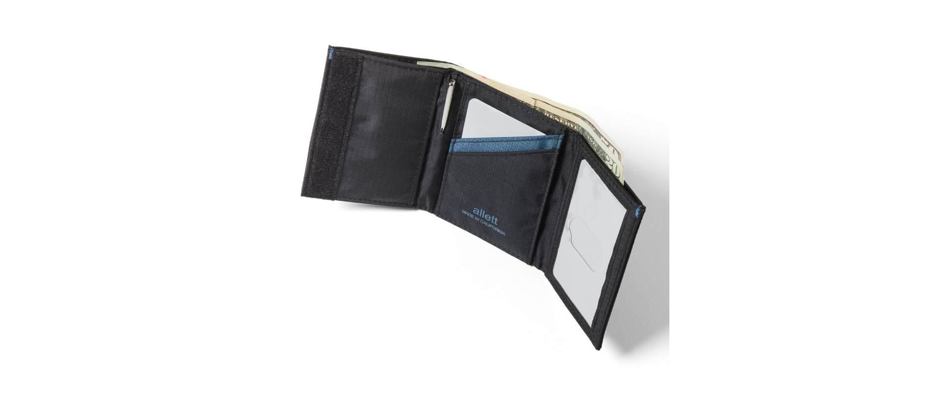 Black nylon trifold wallet opened with the Velcro visible to show how thin this trifold wallet is.