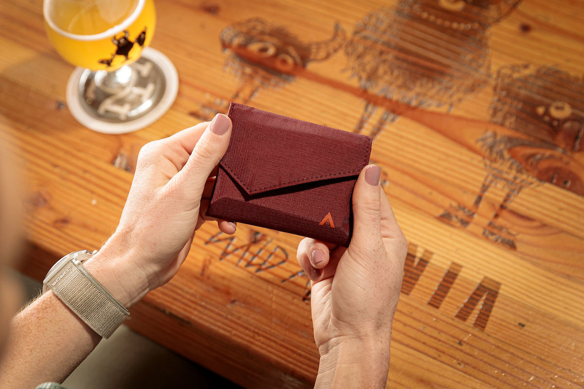 Woman holding Accordion Wallet from Allett