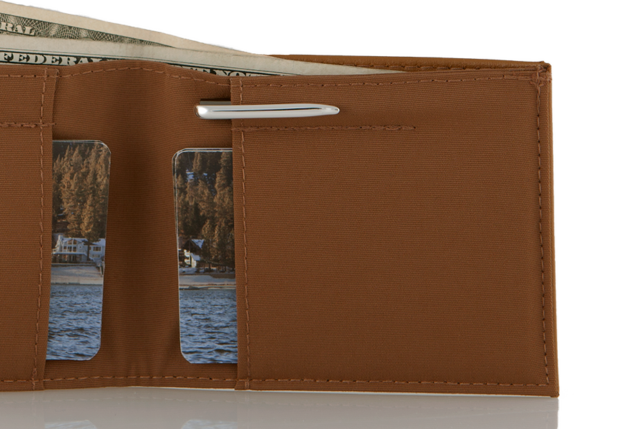 Open wallet featuring a small micro pen sticking out of the leather.