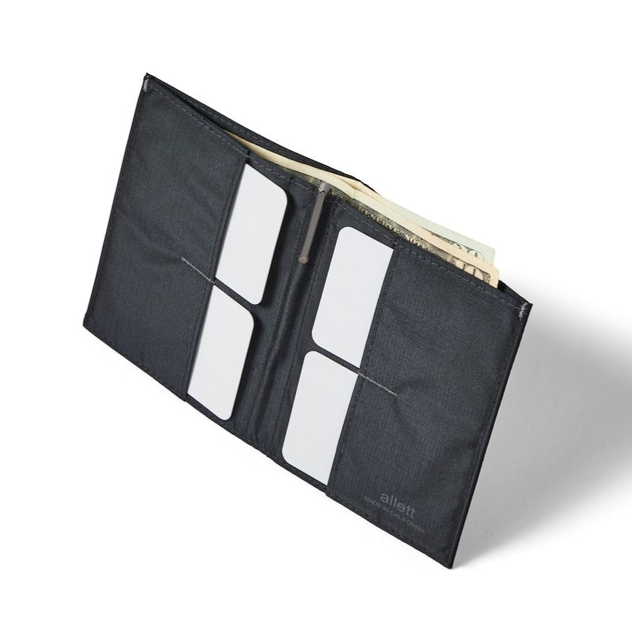 Standing open jet black vegan coin wallet from Allett made with nylon, showing the 2 x 2 grid of credit card pockets. allett coin wallet jet-black