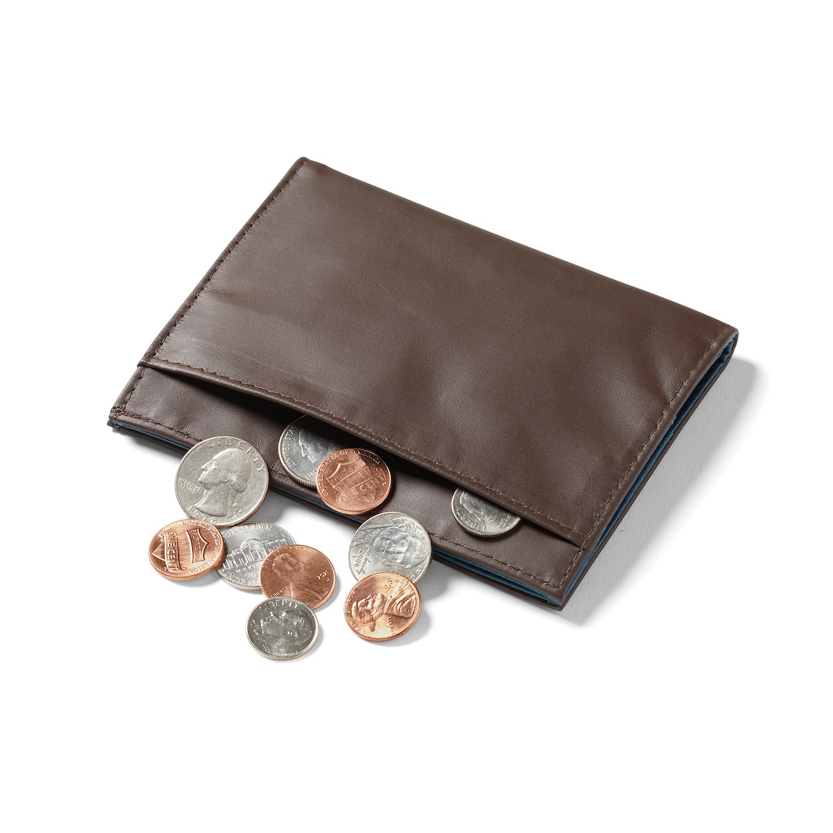 chocolate-brown leather coin wallet 2.0 by Allett coins coming out of pocket