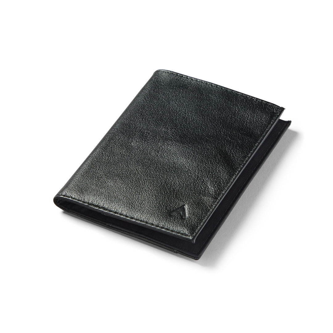 Image displaying an onyx black coin wallet crafted from premium leather. allett leather coin wallet onyx-black