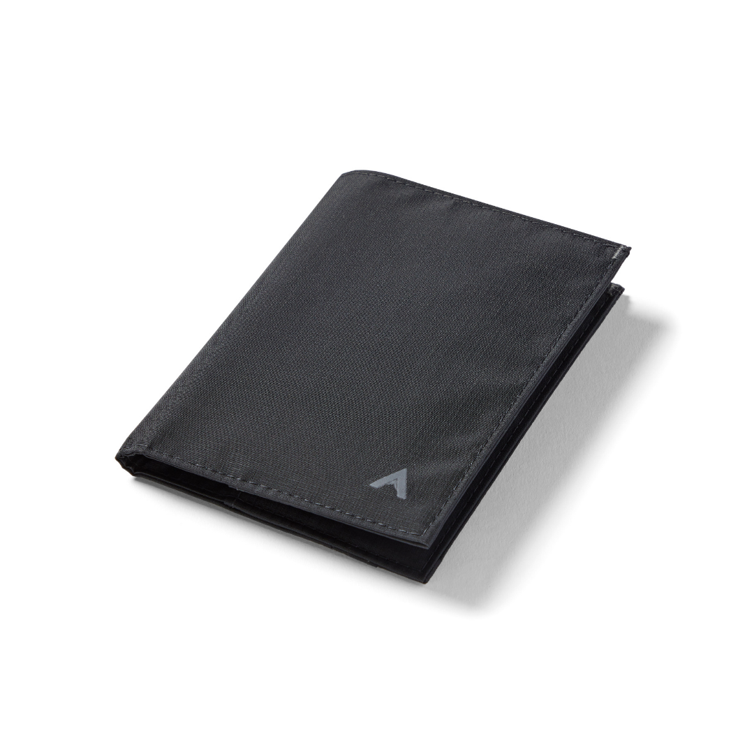 Photo shows a jet black coin wallet made with nylon. allett coin wallet jet-black